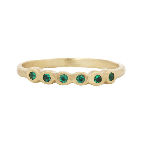 Half pebble band with emeralds